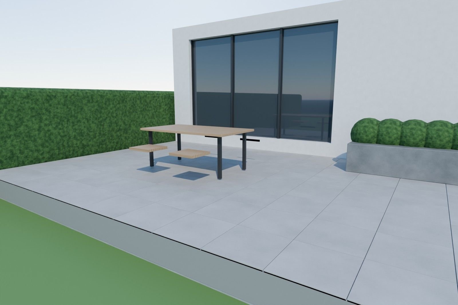 Terrasse mit grauen Außenfliesen und Gartenmöbeln